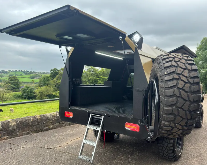 The Explorer Edition rear door open, spare wheel on the door, interior lit