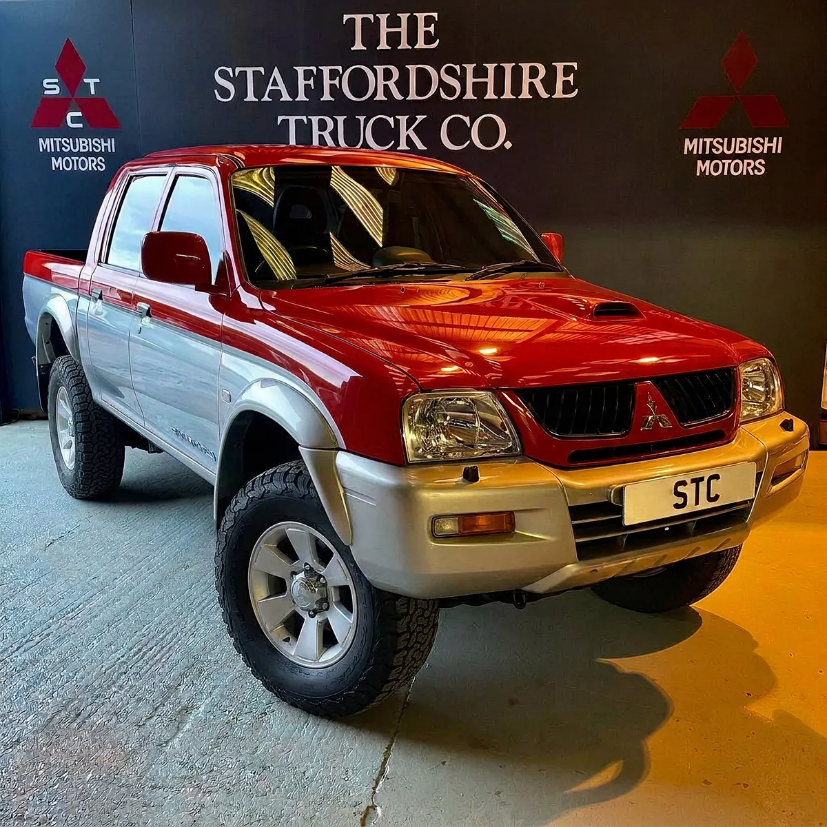 A red and silver STC Heritage Edition L200 in the studio