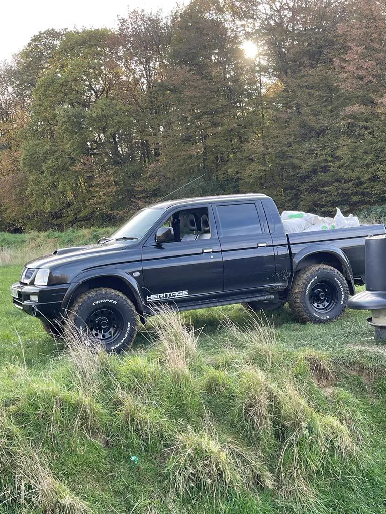 An owner&rsquo;s black Dakar Edition in a clearing