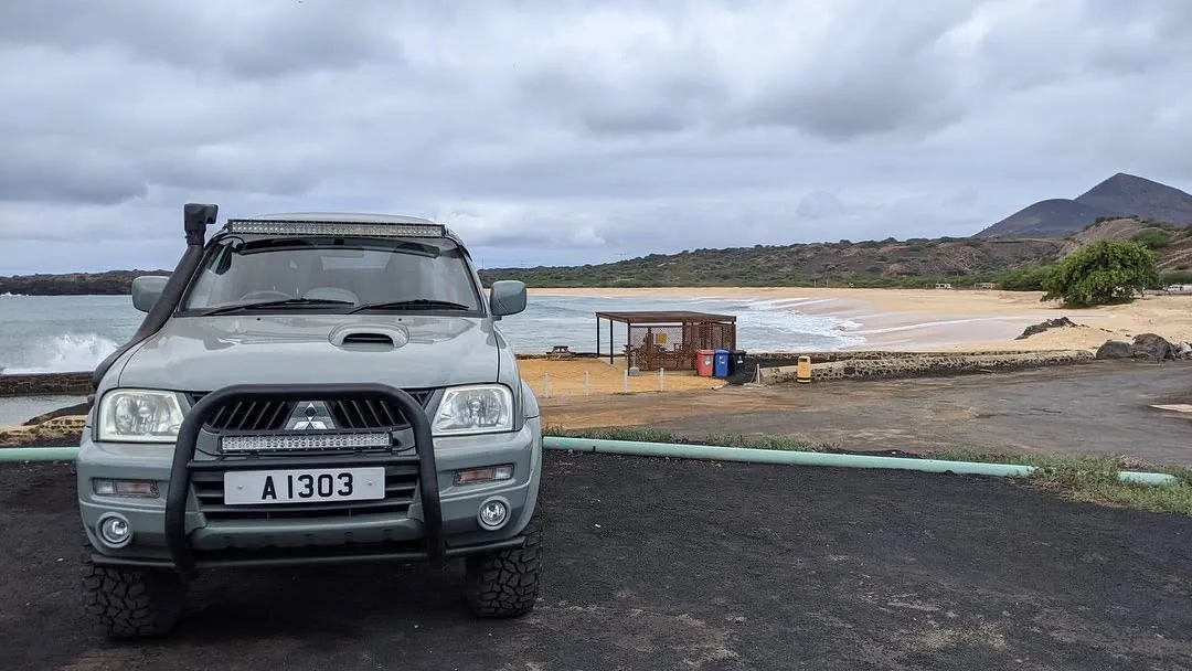 The Dakar parked above a sandy beach