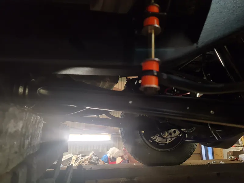 The underside of an L200 on the ramp under the inspection lamp